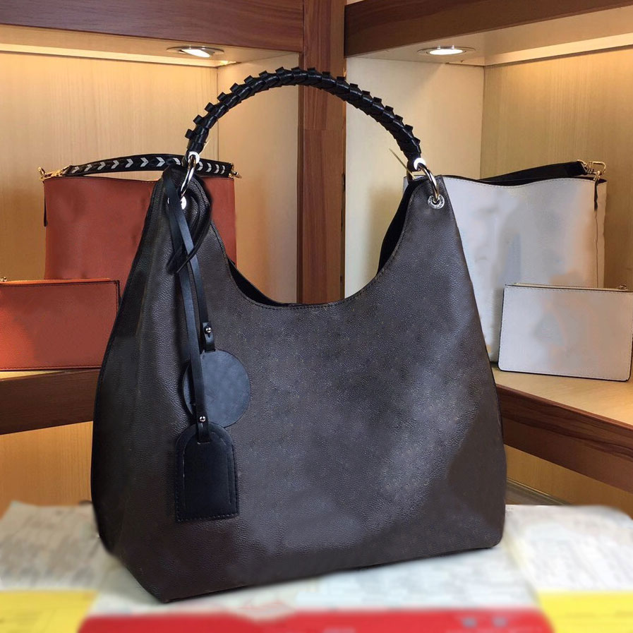 Designers Luxurys Leather Shoulder Bag Taurillon Letter Flower Handbag Carmel Hobo Bag M53188
Designers Luxurys Leather Shoulder Bag Taurillon Letter Flower Handbag Carmel Hobo Bag M53188
