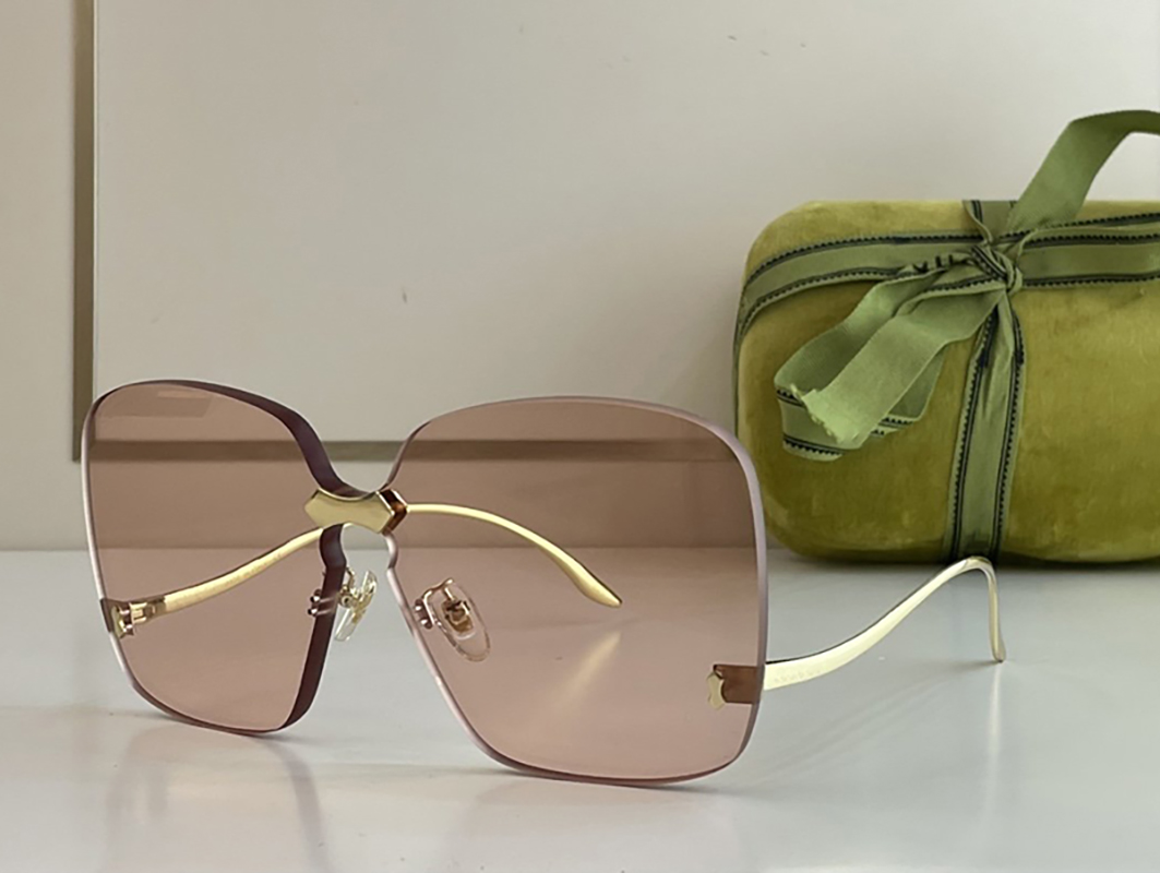 Trendy womens sunglasses designer simple oversized frameless square light brown special shaped gold edge line arm fashion show avant garde personality UV400
Trendy womens sunglasses designer simple oversized frameless square light brown special shaped gold edge line arm fashion show avant garde personality UV400