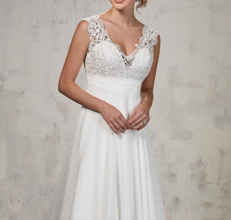 A-line wedding gown features lace top, chiffon skirt, V-neck, pleated empire waist line Bridal Gowns wedding dress