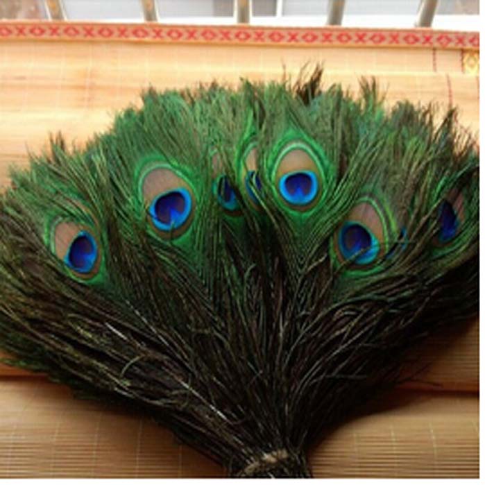 Whole 100pcslot 1044inch25110cm beautiful High quality natural peacock feathers eyes for DIY clothes decoration Wedding2929934