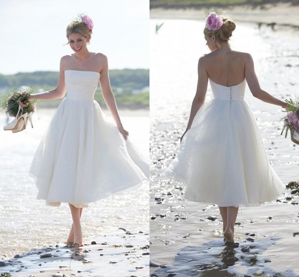White Short beach wedding dresses With Polka Dot Lace A Line tea Length Straples Back Button Elegant Bridal Gown Custom made
White Short beach wedding dresses With Polka Dot Lace A Line tea Length Straples Back Button Elegant Bridal Gown Custom made