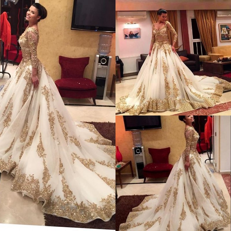 Ivory Tulle Gold Lace Appliques Arabic Wedding Dresses With 3/4 Long Sleeves 2017 V Neck Beaded Sequins Bridal Gowns Plus Size EN9273
Ivory Tulle Gold Lace Appliques Arabic Wedding Dresses With 3/4 Long Sleeves 2017 V Neck Beaded Sequins Bridal Gowns Plus Size EN9273