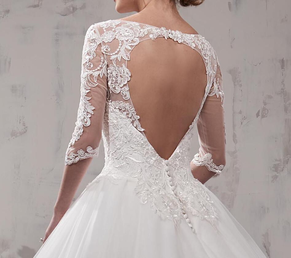 Stunning Ivory Ball Gown Wedding Dresses Scoop Sheer with Applique 3/4 Long Sleeves Backless Floor Length Bridal Gowns Sexy Backless
