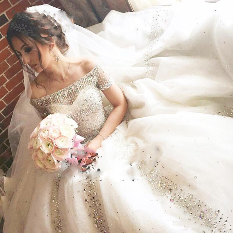 Shinning Beaded Boat Neck Wedding Dresses Sexy Off The Shoulder Short Sleeves Bridal Gowns Sweep Train Wedding Vestidos Custom Made, Same as image
Shinning Beaded Boat Neck Wedding Dresses Sexy Off The Shoulder Short Sleeves Bridal Gowns Sweep Train Wedding Vestidos Custom Made, Same as image