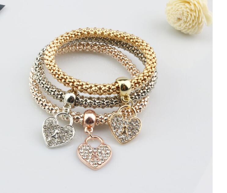 Alloy jewelry three - color stretch diamond love heart lock bracelet European and American women 's fast sell through three - piece