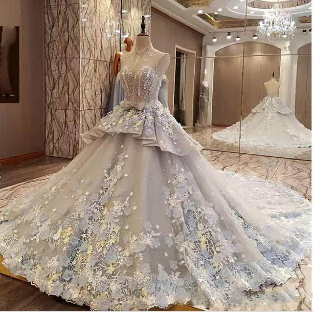 Luxury Floral Appliques Wedding Dresses 2018 Sheer High Neck Sleeveless Bow Peplum Bridal Gowns Vintage Backless Sweep Train Vestidos, Silver
Luxury Floral Appliques Wedding Dresses 2018 Sheer High Neck Sleeveless Bow Peplum Bridal Gowns Vintage Backless Sweep Train Vestidos, Silver