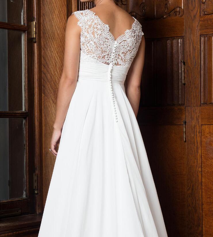 A-line wedding gown features lace top, chiffon skirt, V-neck, pleated empire waist line Bridal Gowns wedding dress