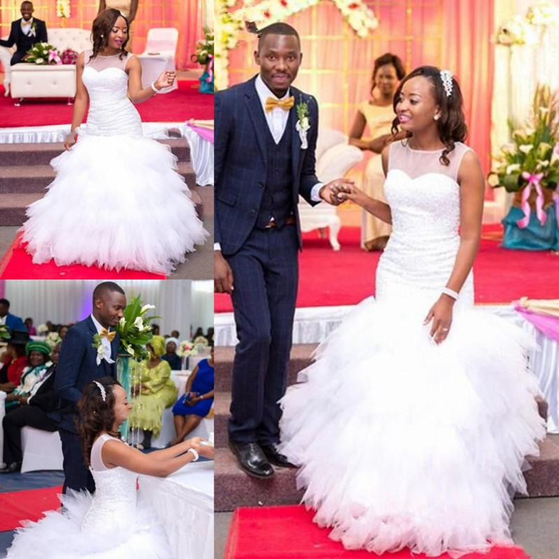 African Mermaid Wedding Dresses Sheer Neck Sleeveless Bridal Gowns Tulle Ruffles Plus Size Wedding Vestidos Custom Made, Same as image
African Mermaid Wedding Dresses Sheer Neck Sleeveless Bridal Gowns Tulle Ruffles Plus Size Wedding Vestidos Custom Made, Same as image