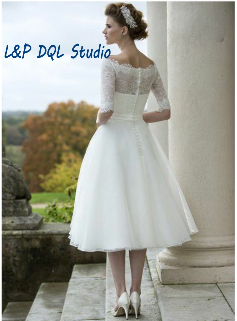 Vintage Ivory Lace Organza Ball Gown Wedding Dresses Scoop Half Sleeves Buttons Back Tea-Length Bridal Gowns Custom Made
Vintage Ivory Lace Organza Ball Gown Wedding Dresses Scoop Half Sleeves Buttons Back Tea-Length Bridal Gowns Custom Made