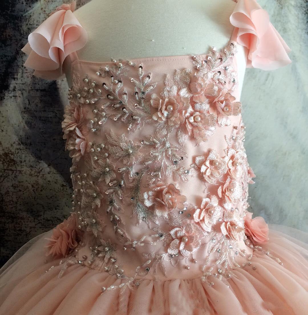 Elegant Pink Tulle Flower Girl Ball Gown with Detailed Beading and Handmade Floral Accents