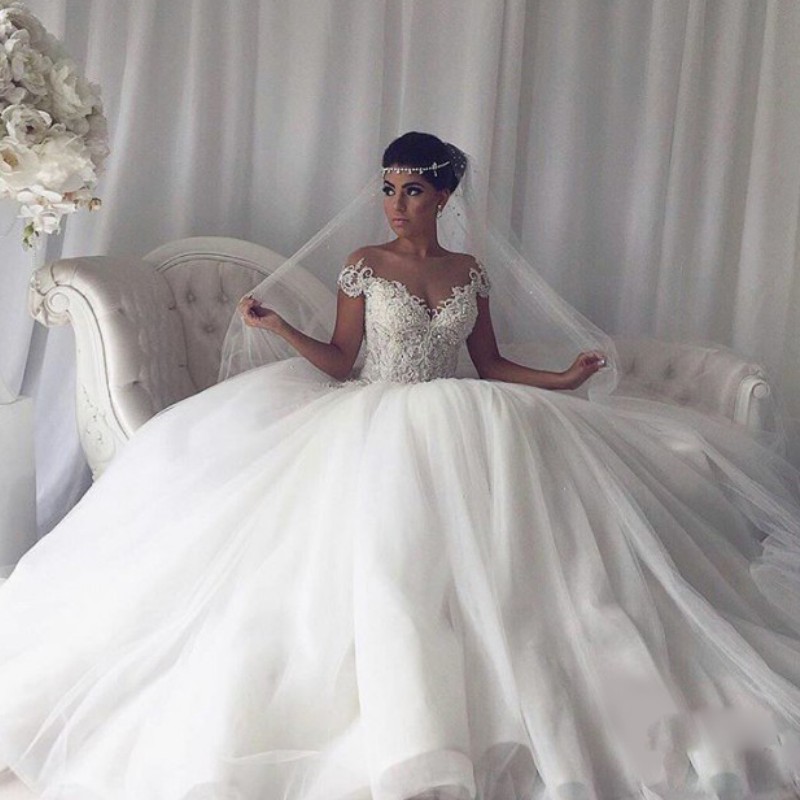 Sheer Jewel Neckline Wedding Dresses Pearls Beaded Applique Capped Sleeves Bridal Wedding Gowns Charming A-Line Puffy Tulle Bridal Dresses, Silver
Sheer Jewel Neckline Wedding Dresses Pearls Beaded Applique Capped Sleeves Bridal Wedding Gowns Charming A-Line Puffy Tulle Bridal Dresses, Silver