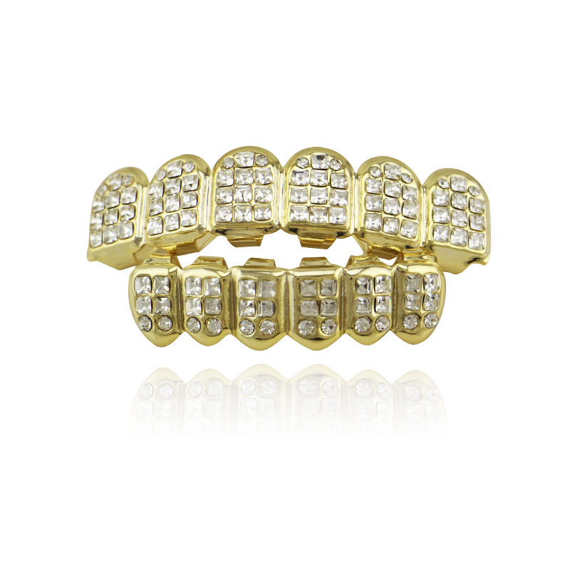 Teeth Caps Dental Grills Crystal Inlay Top & Bottom Mouth Grills Gold Color HipHop Tooth Grillz Men Body Jewelry
Teeth Caps Dental Grills Crystal Inlay Top & Bottom Mouth Grills Gold Color HipHop Tooth Grillz Men Body Jewelry
