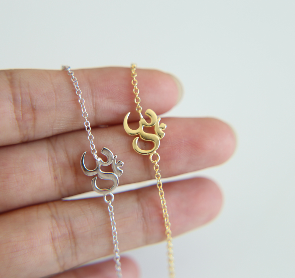 tiny yoga charm bracelet in 925 sterling silver material om bracelet with yellow gold rhodium plated