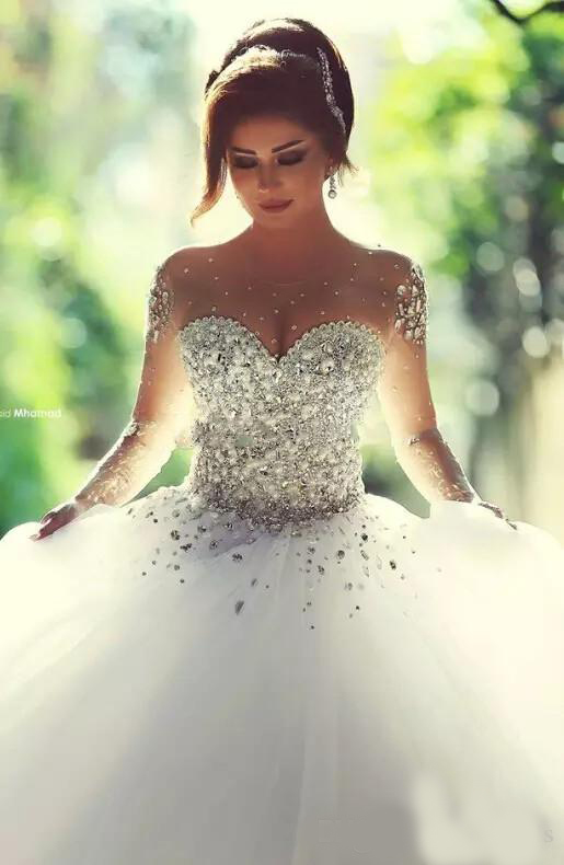 2020 Arabic Luxury Crystal Wedding Dresses with Rhinestone Beads A Line Sheer Illusion Crew Neck Long Sleeves Floor Length Bridal Gowns