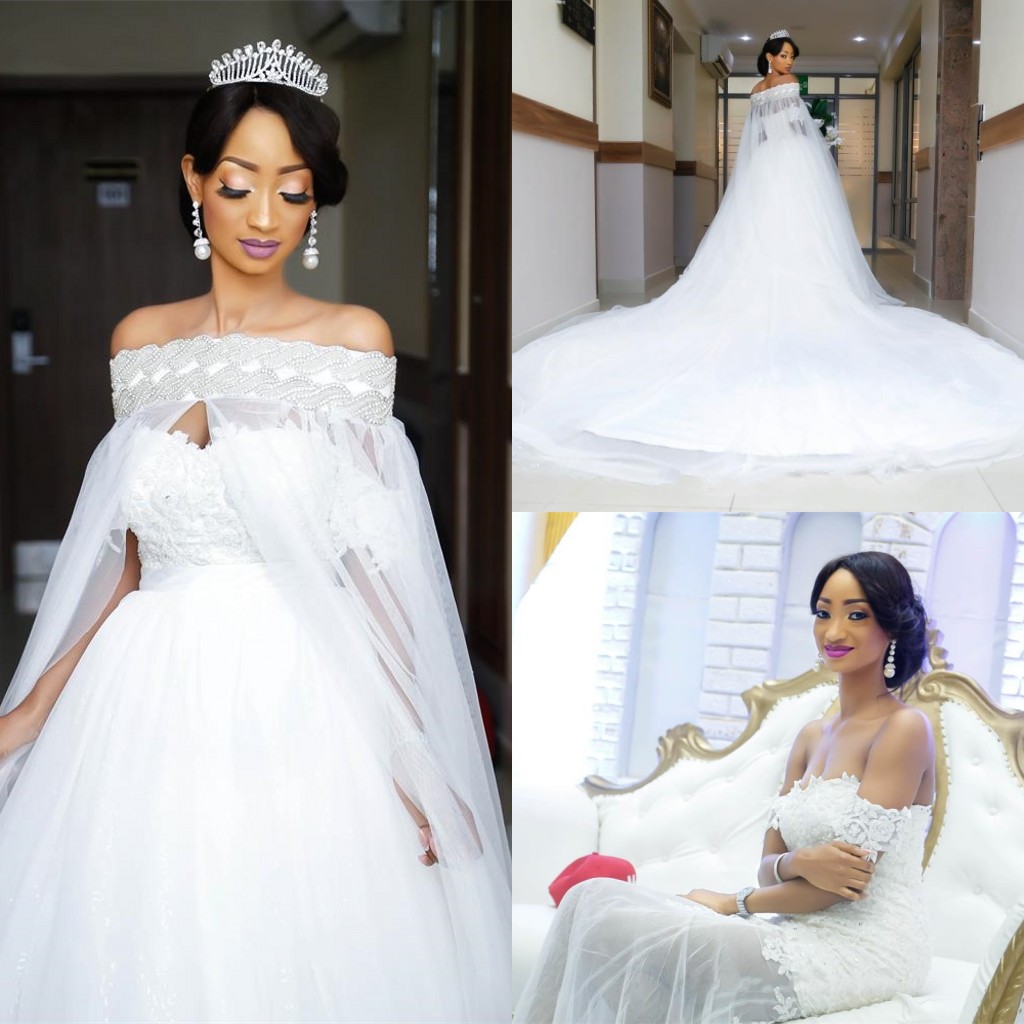 Arabic White Elegant Off The Shoulder Wedding Dresses with Cape Train Overskirt Crystal Lace Bridal Wedding Gowns with Detachable Skirt 
Arabic White Elegant Off The Shoulder Wedding Dresses with Cape Train Overskirt Crystal Lace Bridal Wedding Gowns with Detachable Skirt