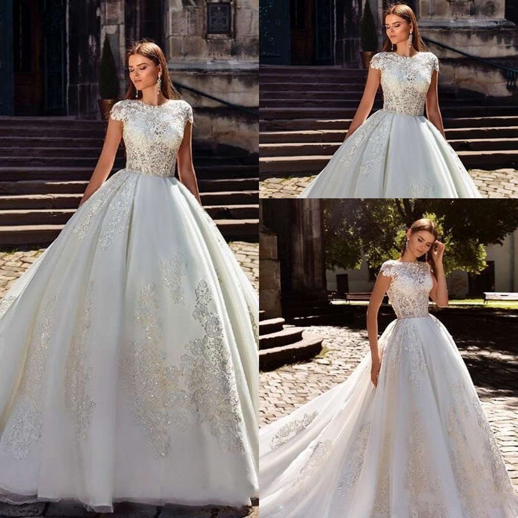 2018 Cheap Ball Gown Wedding Dresses Jewel Neck Illusion Cap Sleeves Lace Appliques Beaded Organza Arabic Plus Size Formal Bridal Gowns, White 
2018 Cheap Ball Gown Wedding Dresses Jewel Neck Illusion Cap Sleeves Lace Appliques Beaded Organza Arabic Plus Size Formal Bridal Gowns, White