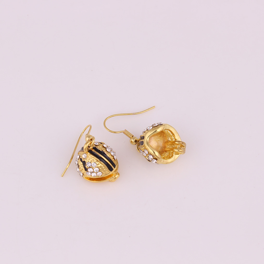 Good Quality Helmet Charm Pendant Studded With Crystal Black Enamel Gold Color Earrings, Golden
Good Quality Helmet Charm Pendant Studded With Crystal Black Enamel Gold Color Earrings, Golden