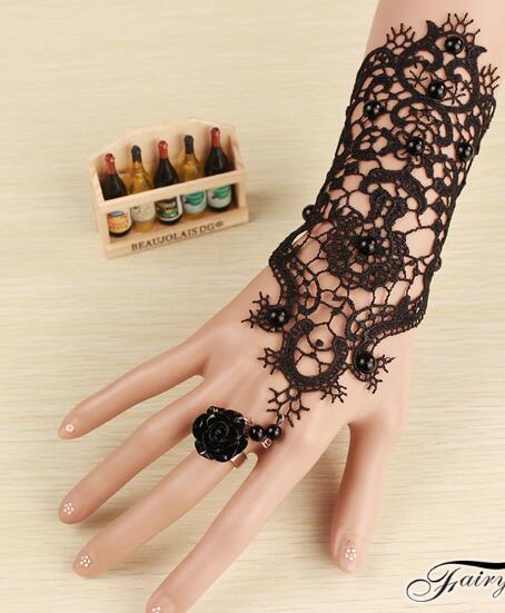 Free shipping The dress is accessorised with black lace bracelet and ring, integrated armband, fashion and classic elegance