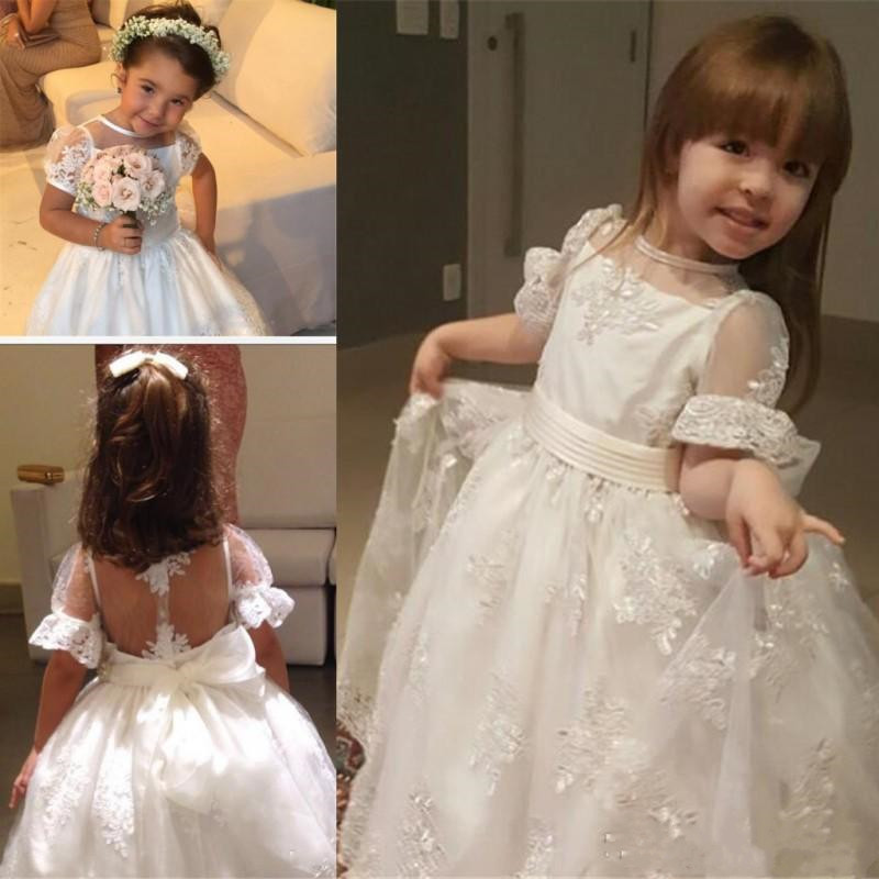 Lace Flower Girls Dresses Sheer Neckline Short Sleeves Girl Pageant Dress Beads First Communion Gowns With Big Bow Back, Silver
Lace Flower Girls Dresses Sheer Neckline Short Sleeves Girl Pageant Dress Beads First Communion Gowns With Big Bow Back, Silver