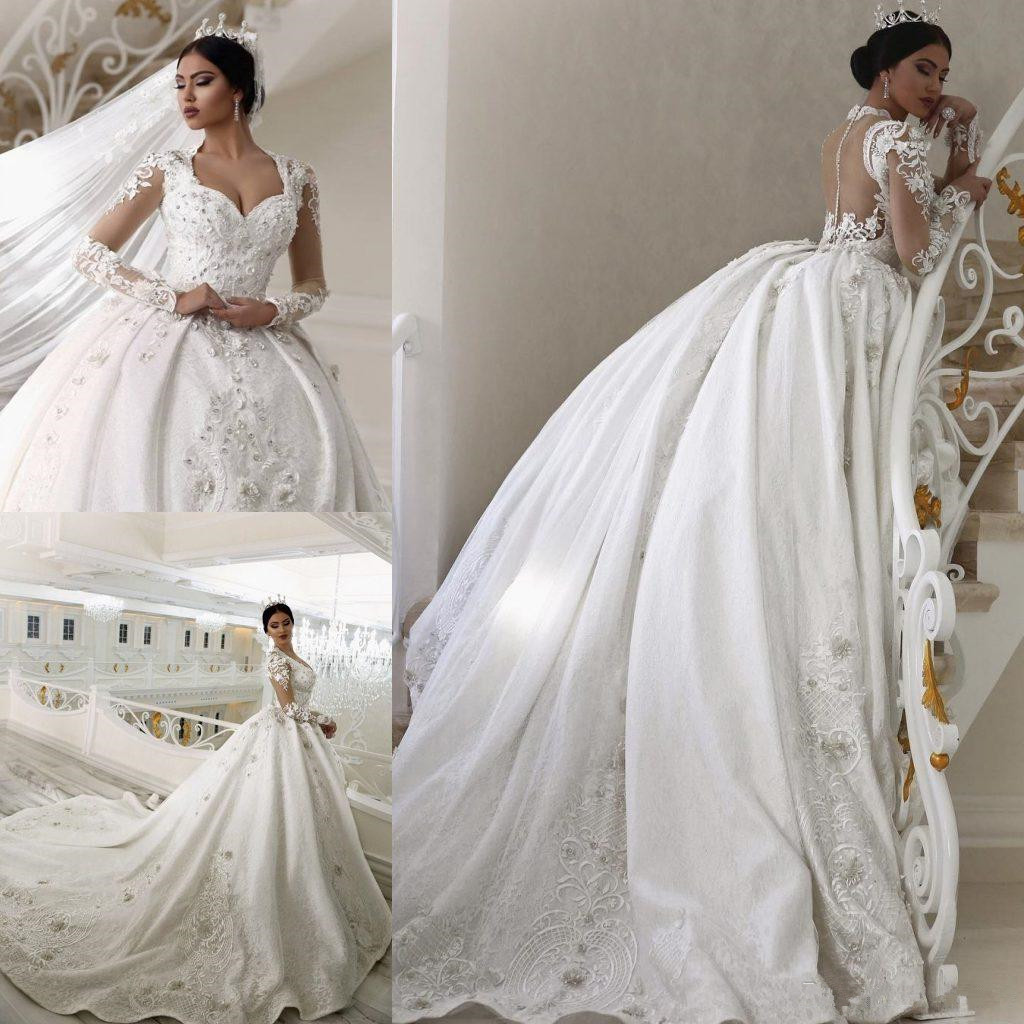 2018 Ball Gown Wedding Dresses Arabic Sweetheart Sheer Long Sleeves Lace Beaded Applique Button Back Chapel Train Plus Size Bridal Gowns, White
2018 Ball Gown Wedding Dresses Arabic Sweetheart Sheer Long Sleeves Lace Beaded Applique Button Back Chapel Train Plus Size Bridal Gowns, White