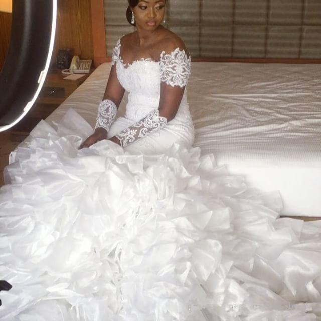 2019 Mermaid Wedding Dresses Sheer Jewel Neck Tiered Skirts Sweep Train Plus Size Wedding Dress Lace Appliques Long Sleeve Bridal Gowns