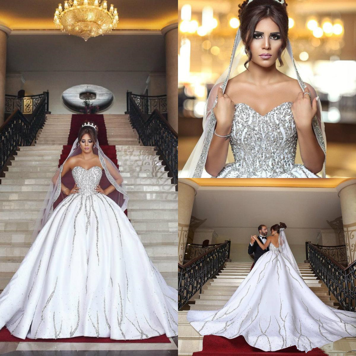 2019 Luxury Bling Dubai Arabic Plus Size Wedding Dresses Beads Sequins Sweetheart Backless court Train lace up Country Wedding Dress, Same as image
2019 Luxury Bling Dubai Arabic Plus Size Wedding Dresses Beads Sequins Sweetheart Backless court Train lace up Country Wedding Dress, Same as image