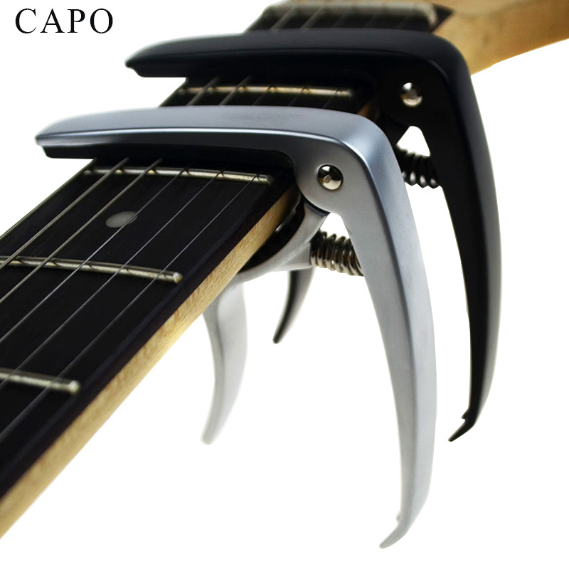 Nueva guitarra acústica y guitarra eléctrica capo plata y negro modelos opcionales de aluminio guitarra partes Accesorios 
Nueva guitarra acústica y guitarra eléctrica capo plata y negro modelos opcionales de aluminio guitarra partes Accesorios