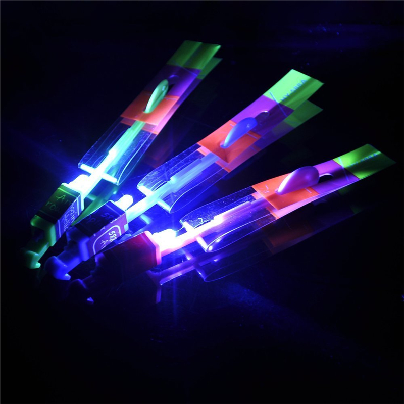 Amazing LED Light Arrow Rocket Helicopter Rotating Flying Toys Flying Catapult Toy Light Up Toy Kid Party Favor Toy Fun Gift Elastic