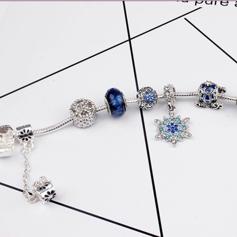 Elegant Blue Starry Night Charm Bracelet Adorned With Snowflakes and Halloween Pumkins Artisanal Glass Bead Jewelry