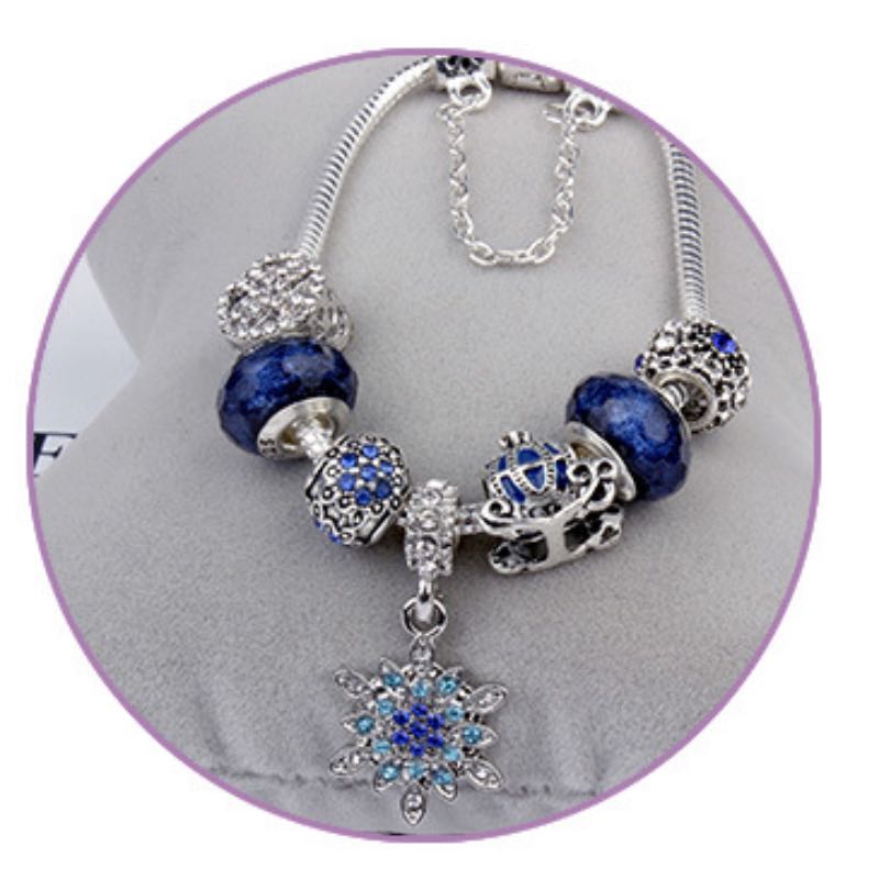 Elegant Blue Starry Night Charm Bracelet Adorned With Snowflakes and Halloween Pumkins Artisanal Glass Bead Jewelry