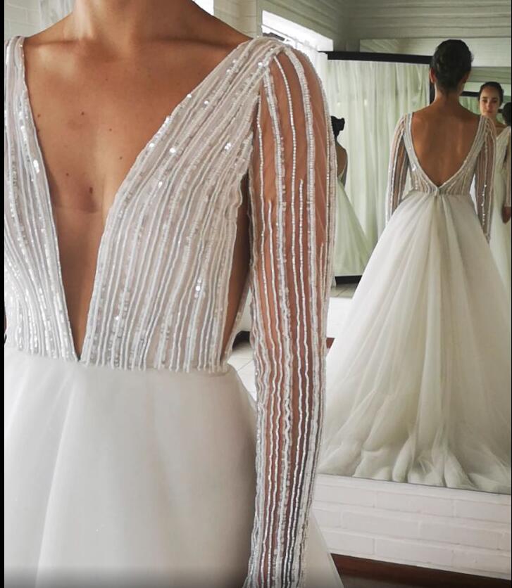 Arabic 2019 Sexy Cheap Beaded Sequins Wedding Dresses Deep V-neck Long Sleeves Bridal Dresses Backless Wedding Gowns ZJ164