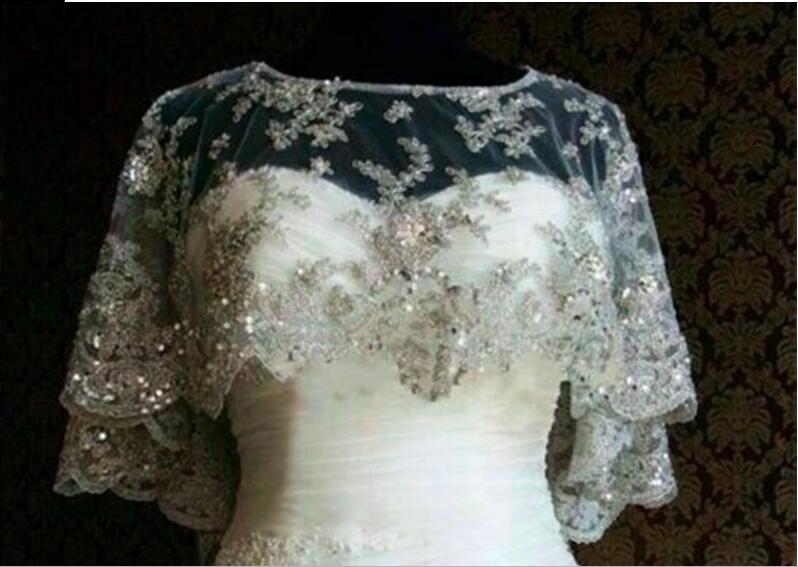 Real Image Sparkling Wedding Cloak Jacket New Ivory White Sleeveless Bridal Lace Applique Sequins Cape Wraps Custom Jackets