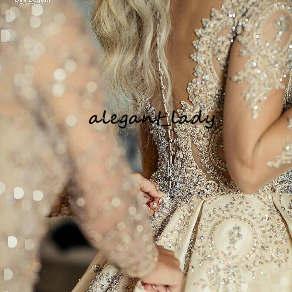 Illusion Long Sleeve Wedding Dresses 2020 Sheer Neck Gold Champagne Sparkly Beaded Lace Applique Princess Big Train Wedding Gown