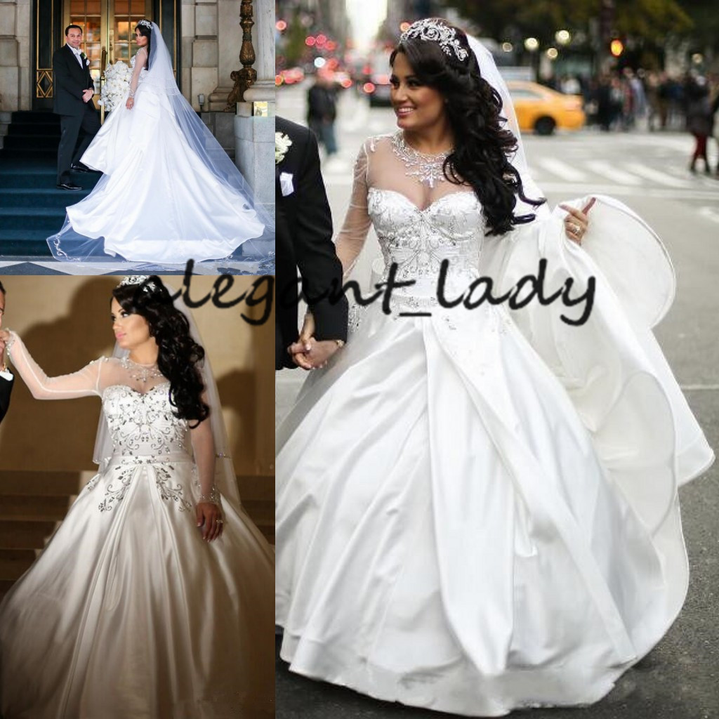 Illusion Long Sleeve Princess Wedding Dresses 2020 Sparkly Crystal Beaded Sheer Neck Puffy Skirt Church Bride Wedding Gowns