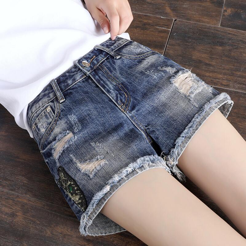 Chic jeans summer new Korean version of loose elegant fashion hole embroidery sequins Slim casual plus size women's hot pants, Blue
Chic jeans summer new Korean version of loose elegant fashion hole embroidery sequins Slim casual plus size women's hot pants, Blue