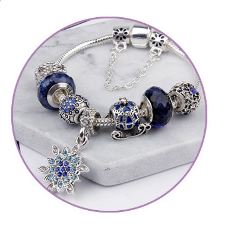 Elegant Blue Starry Night Charm Bracelet Adorned With Snowflakes and Halloween Pumkins Artisanal Glass Bead Jewelry