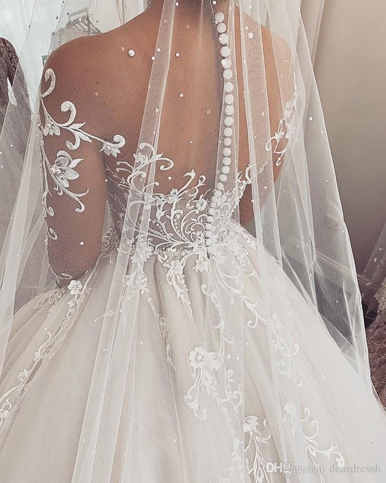 2019 Gorgeous Modest Wedding Dresses Sheer Jewel Neck Lace Appliqued Long Train Country Wedding Gowns Long Sleeve Bridal Dress Beach Occasio