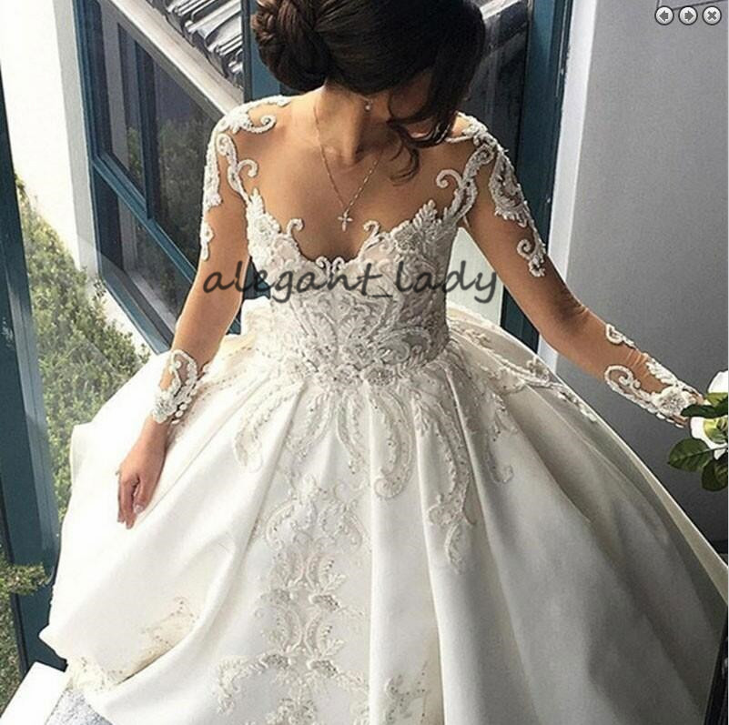 Round Neck Long Sleeves Chapel Train Wedding Dresses 2019 Luxury Lace Applique Middle East Arabic Princess Church Royal Wedding Gown Veil