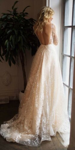 2020 Beach Wedding Dresses Sheer Jewel Neck Long Sleeve Appliqued Bridal Gowns Sweep Train Backless A Line Wedding Gowns