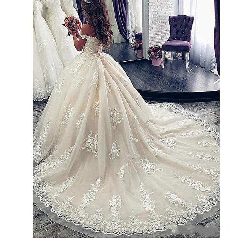 2019 New urious Ball Gown Wedding Dresses Off Shoulder Lace Appliques Sexy Open Back Sweep Train Plus Size Puffy Formal Bridal Gowns