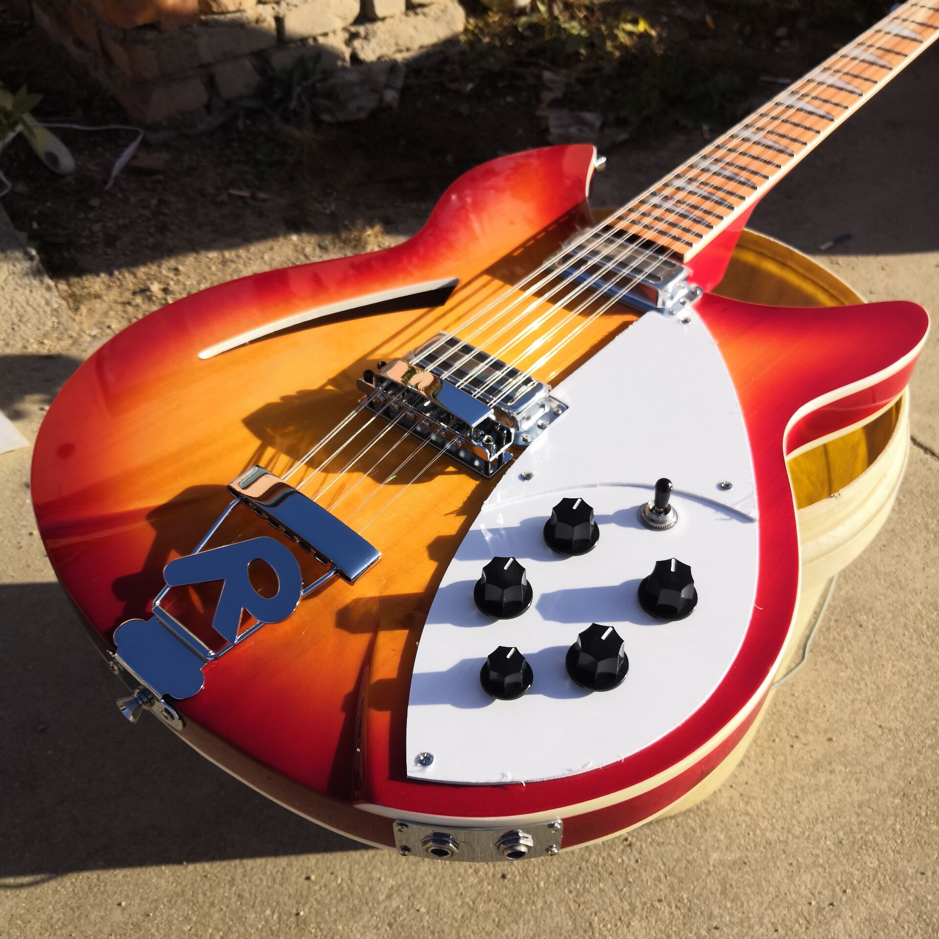 RIC Cherry Sunburst 360 330 12 Strings Flame Maple Top Electric Guitar Semi Hollow Body, Single F Hole, Triangle Pearl Inlay, 2 Input Jacks
RIC Cherry Sunburst 360 330 12 Strings Flame Maple Top Electric Guitar Semi Hollow Body, Single F Hole, Triangle Pearl Inlay, 2 Input Jacks