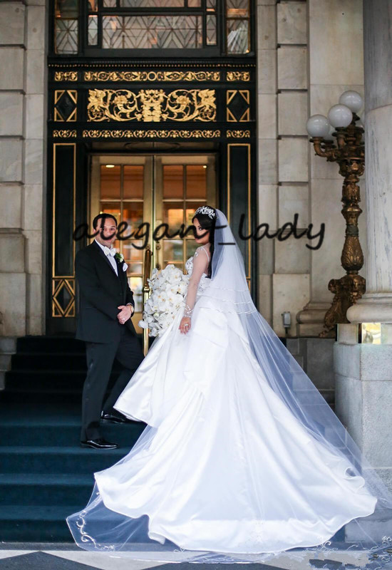 Illusion Long Sleeve Princess Wedding Dresses 2020 Sparkly Crystal Beaded Sheer Neck Puffy Skirt Church Bride Wedding Gowns