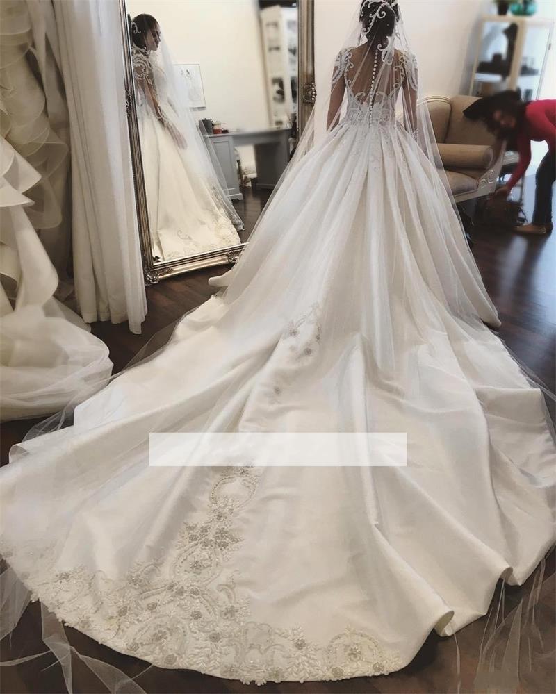 Vintage Illusion Long Sleeves Wedding Gowns Dress Lace Applique Beaded Sheer Neck Backless Ruffled Long Train Satin Bridal Gown