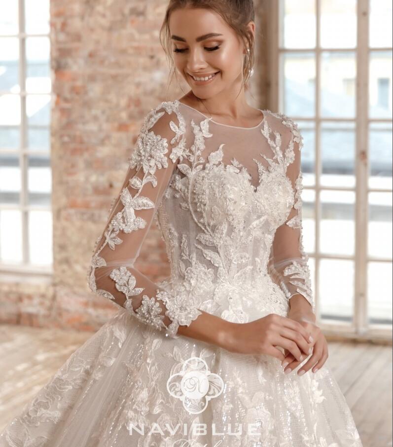 2019 Naviblue Dolly Beach Wedding Dresses Jewel Neck Lace Appliqued A Line Glitter Long Sleeve Modest Wedding Dress Court Train Bridal Gowns