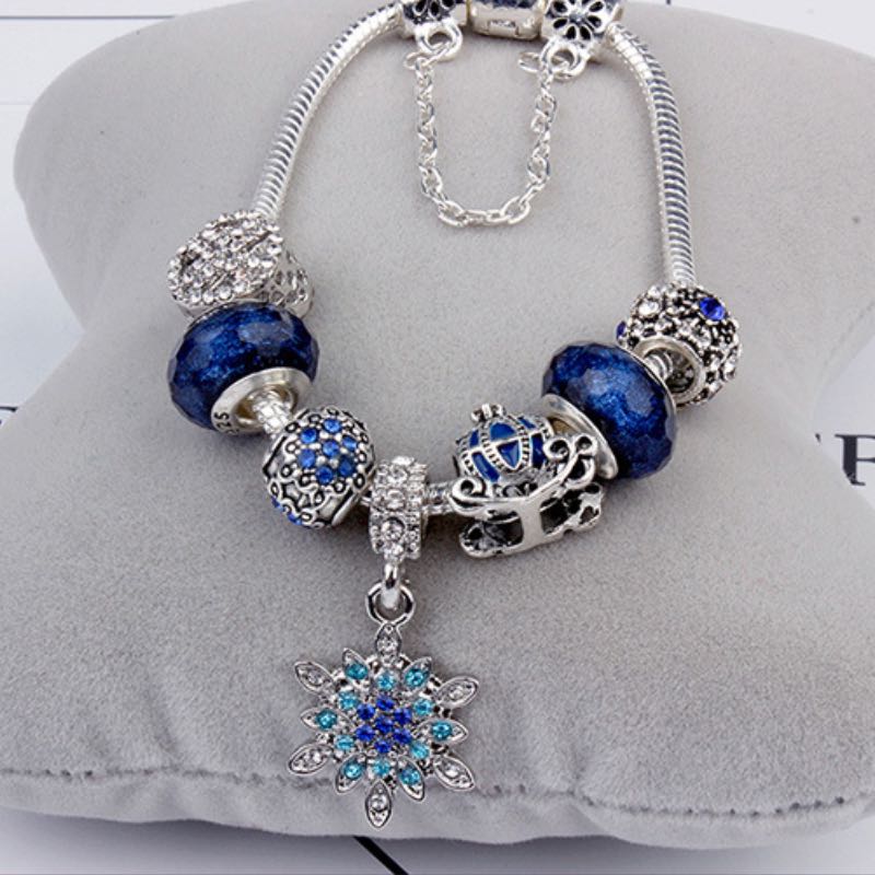 Elegant Blue Starry Night Charm Bracelet Adorned With Snowflakes and Halloween Pumkins Artisanal Glass Bead Jewelry