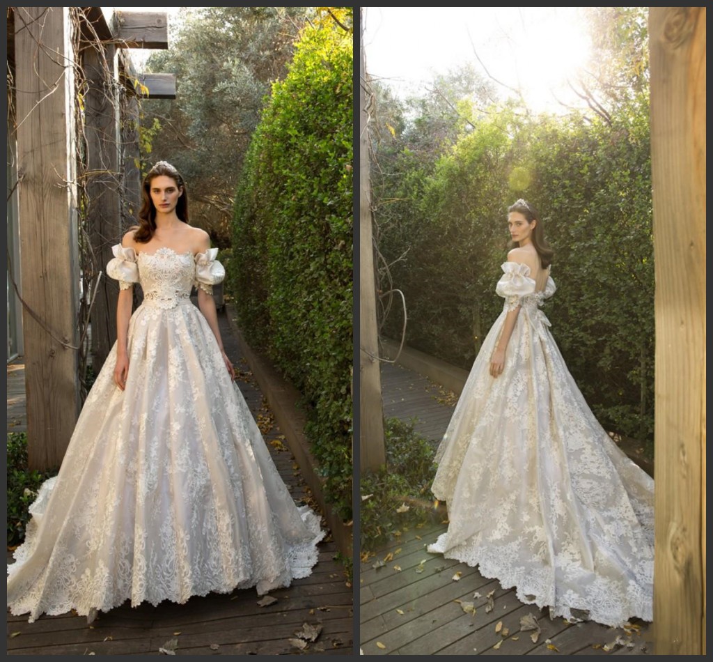 2020 New Vintage A-line Lace Applique Wedding Dresses With Puff Sleeves Off-Shoulder Neckline Chapel Train Illusion Bodice Bridal Gowns