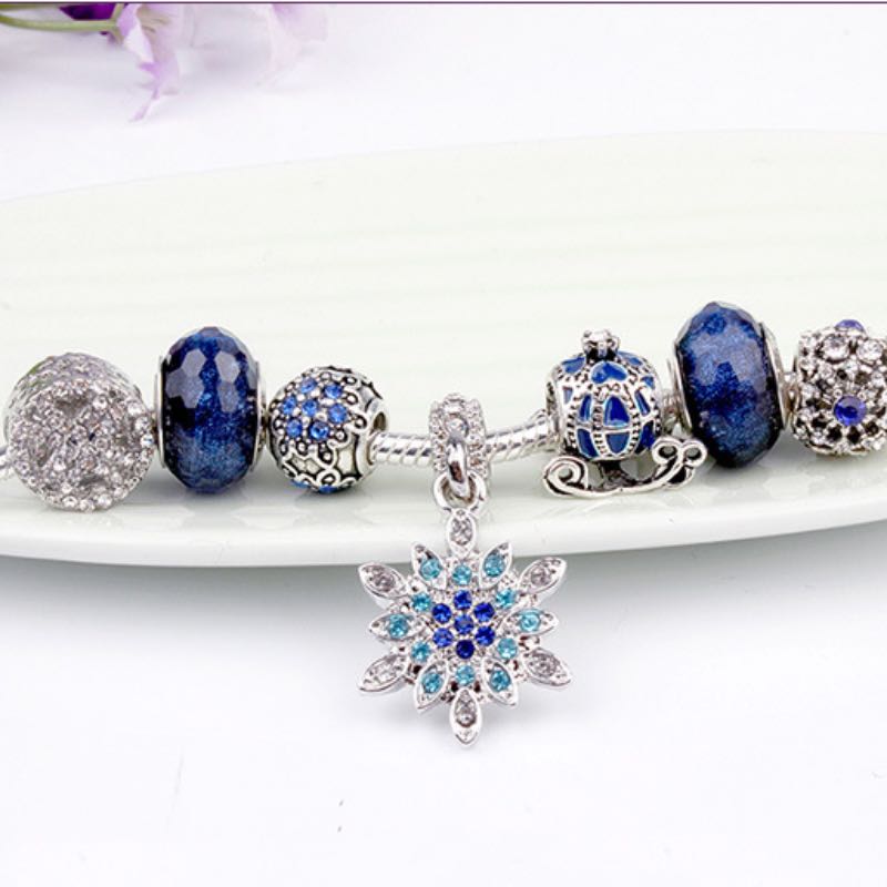 Elegant Blue Starry Night Charm Bracelet Adorned With Snowflakes and Halloween Pumkins Artisanal Glass Bead Jewelry