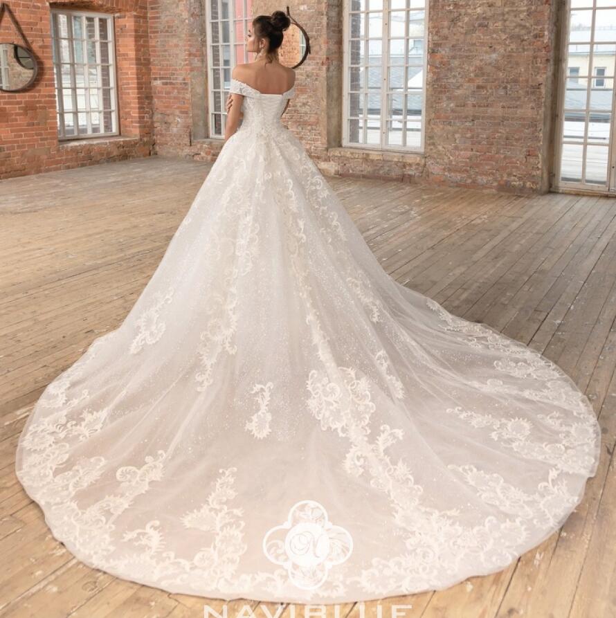 2019 Naviblue Dolly Beach Wedding Dresses Off The Shoulder Lace Appliqued A Line Glitter Modest Wedding Dress Court Train Bridal Gowns