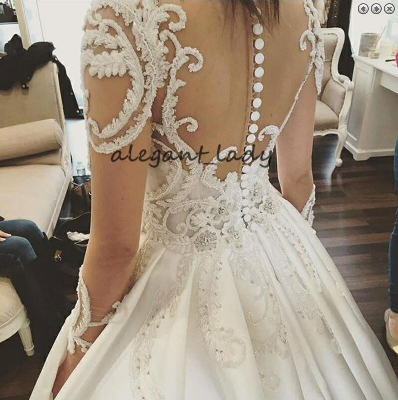 Round Neck Long Sleeves Chapel Train Wedding Dresses 2019 Luxury Lace Applique Middle East Arabic Princess Church Royal Wedding Gown Veil
