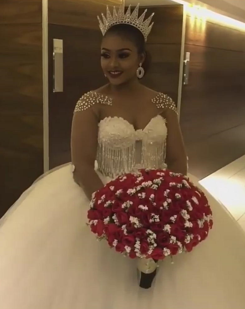 Luxury Crystal Princess Ball Gown Wedding Dresses 2021 Illusion Long Sleeve Open Back Lace Beading Tassel Dress Arabic Dubai Bridal Gowns
